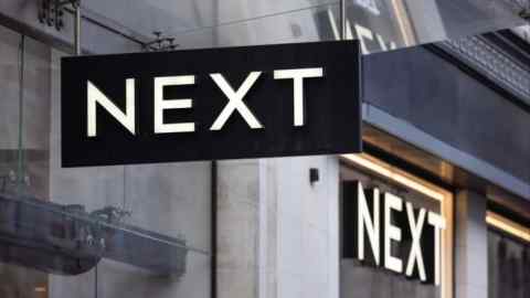 A sign above the entrance to a Next store on Oxford Street in London