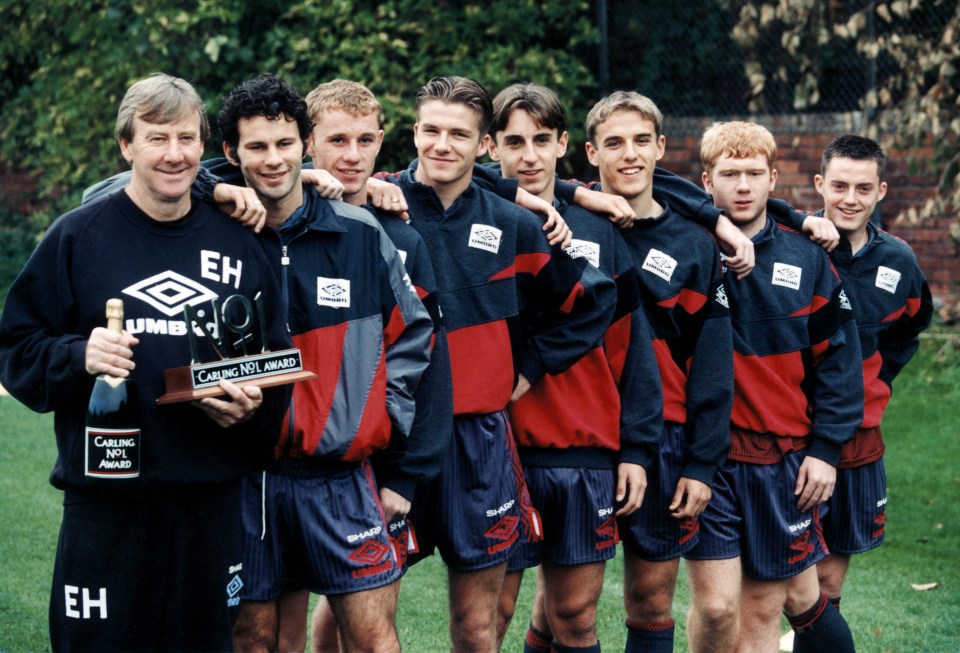 Manchester United youth team coach Eric Harrison with players receiving an award.