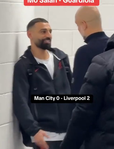 Salah and Guardiola talking after a Liverpool win.