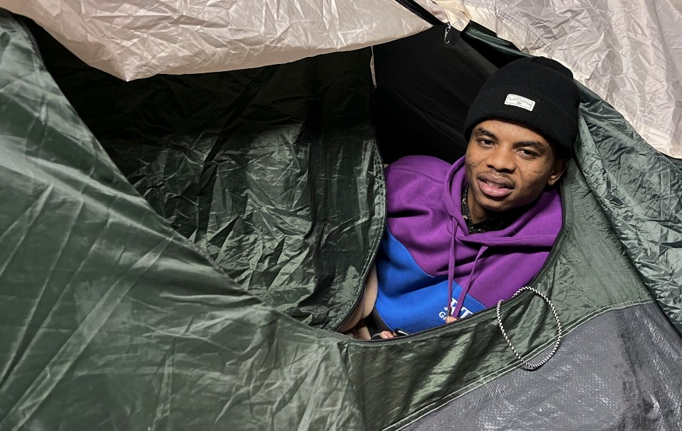 Man inside a tent.