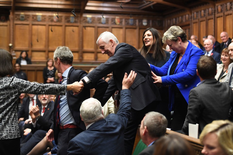 Lindsay Hoyle, the new Speaker of the House, being led to his seat in the House of Commons.