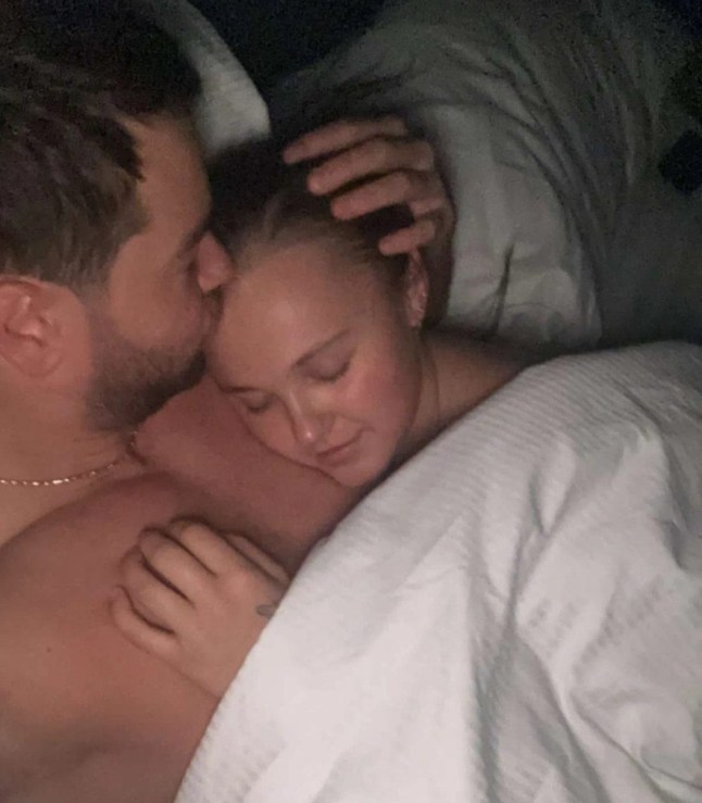 Chris Hughes and JoJo Siwa snuggle in bed in post on Instagram Story (Picture: Instagram/Chris Hughes)