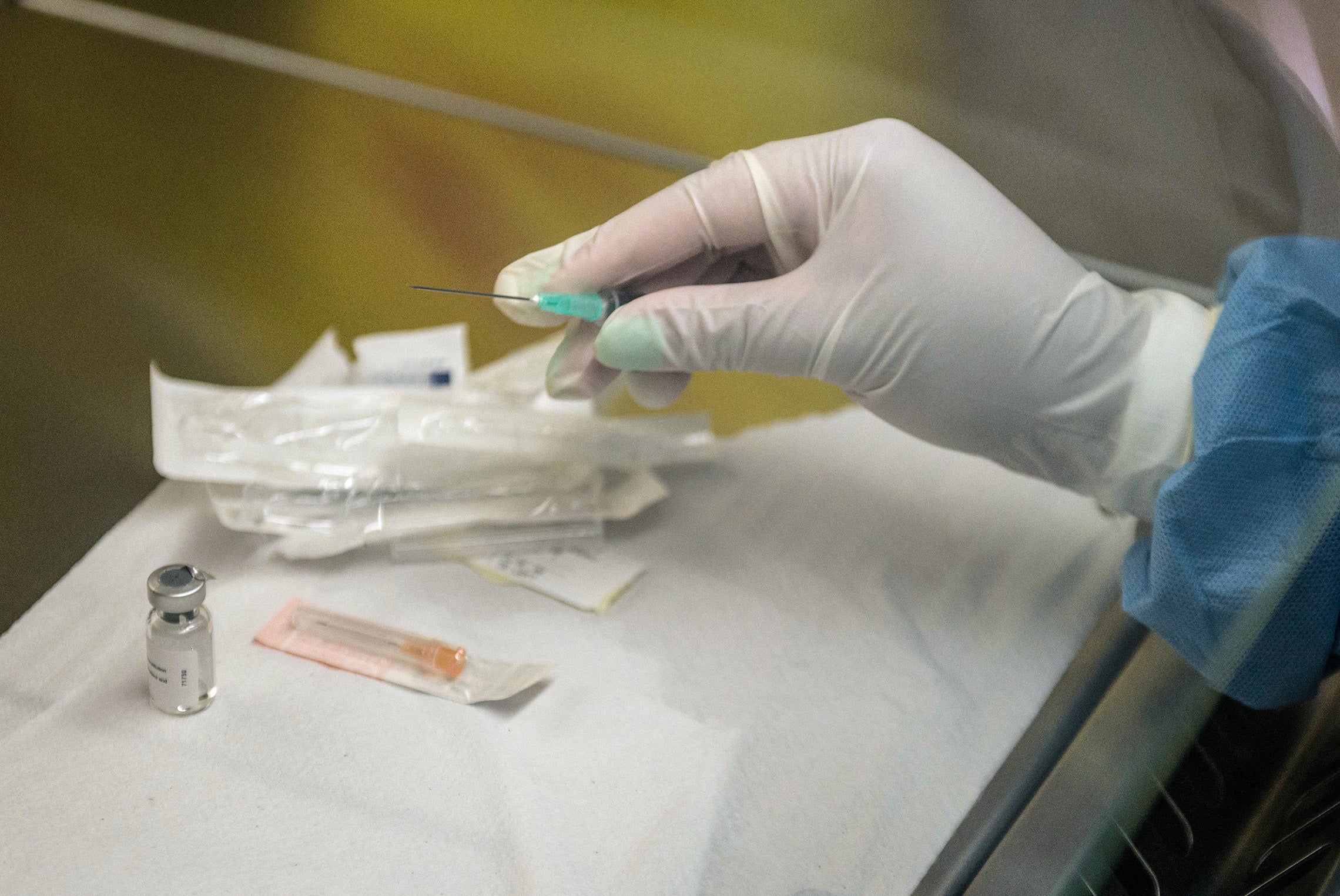 Person holds an experimental vaccine against the AIDS