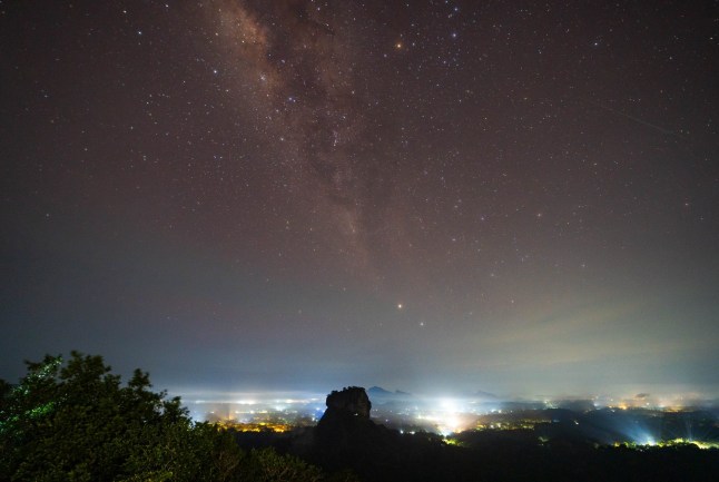 Mandatory Credit: Photo by Thilina Kaluthotage/NurPhoto/Shutterstock (15286520f) An Eta Aquariid meteor is seen over the UNESCO World Heritage Site Sigiriya Rock in Dambulla, Sri Lanka, on May 6, 2025. Eta Aquariids Meteor Showers Seen Over Sigiriya, Sri Lanka, Dambulla - 06 May 2025