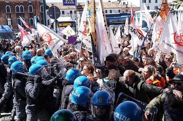 Pictured: Protesters confront police officers during a demonstration in Piazzale Roma against the introduction of an entrance fee to the city for day-trippers, in Venice, 2024