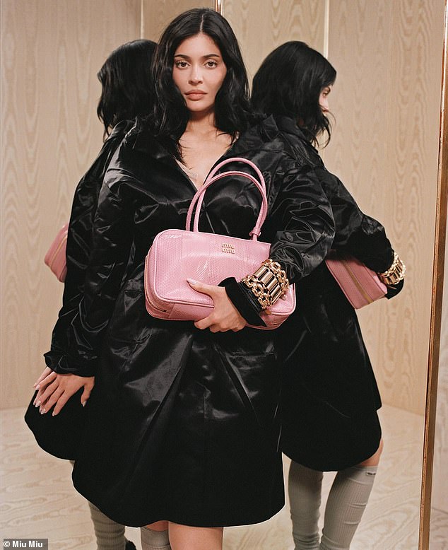 The mom-of-two later sported a black jacket that was seemingly made of a satin material and was partially unfastened around the neckline