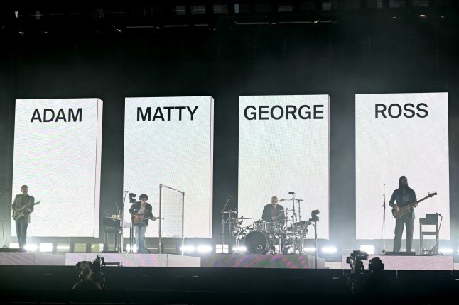 TOPSHOT - British band The 1975 perform on third day of the Glastonbury festival at Worthy Farm in the village of Pilton in Somerset, south-west England, on June 27, 2025. (Photo by Oli SCARFF / AFP) (Photo by OLI SCARFF/AFP via Getty Images)