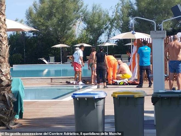Horrified bystanders and staff at Le Mimose del Club del Sole holiday village were seen crowding round a figure believed to be Baumgartner, who was lying poolside