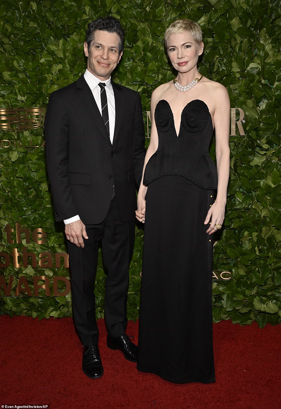 Supportive spouse: Her husband, Thomas Kail, best known for directing the Off-Broadway and Broadway productions of Lin-Manuel Miranda's musicals In the Heights and Hamilton, held her hand on the red carpet