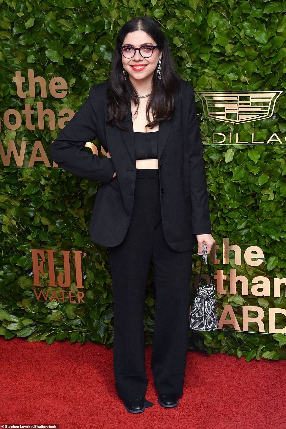 Bold: Zelda Wengrod, known for The Staircase, bared her toned midriff in a black crop top under an oversized blazer