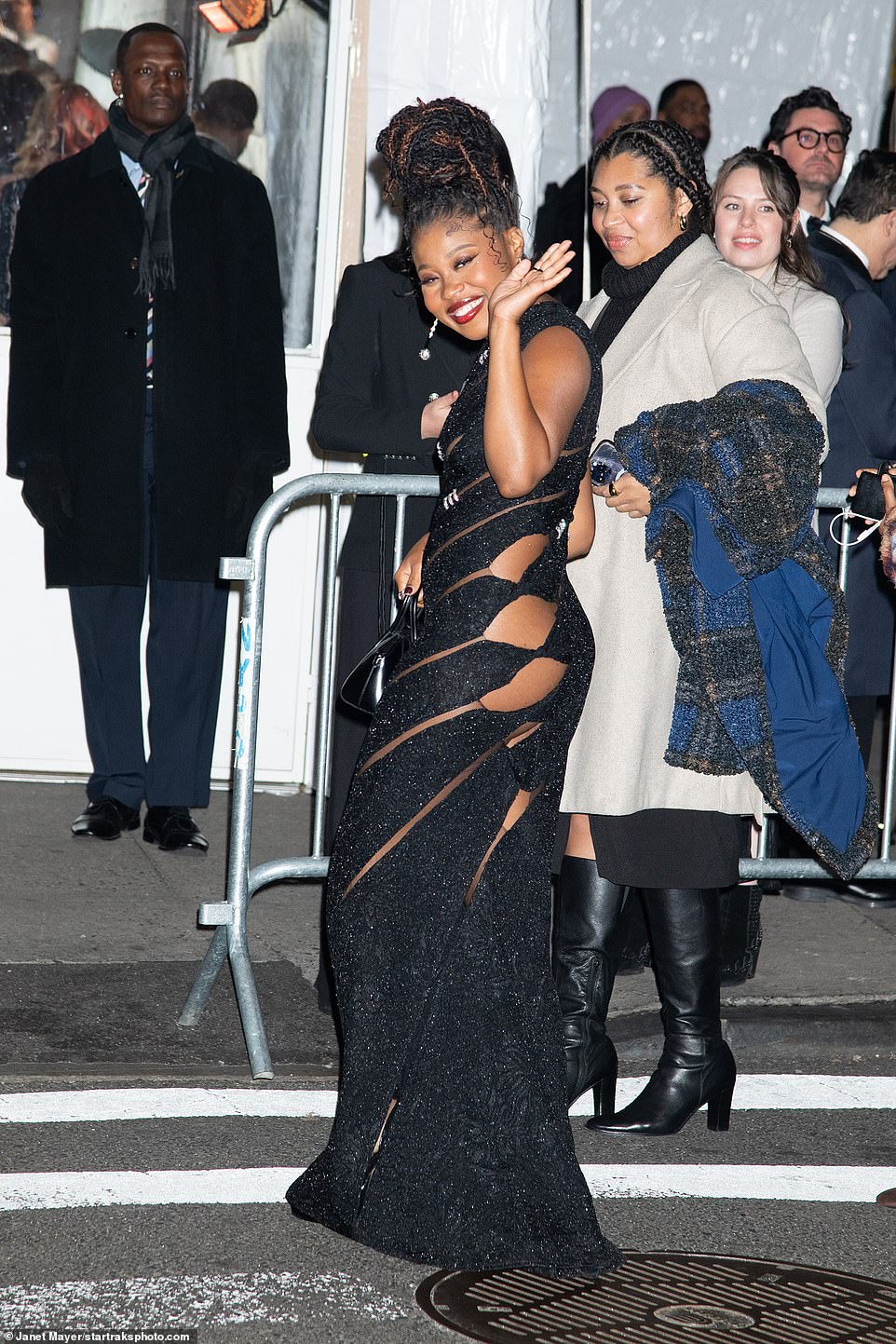 Turning heads: Fishback exuded glamour in her figure-hugging black cutout dress