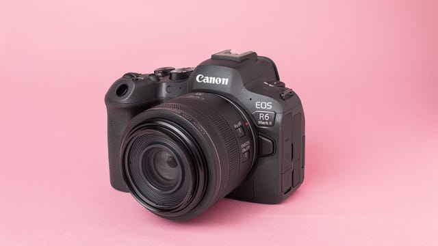 Image of a camera on a pink background