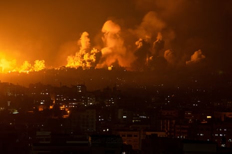 Fire and smoke rise after an Israeli airstrike in Gaza City, 8 October 