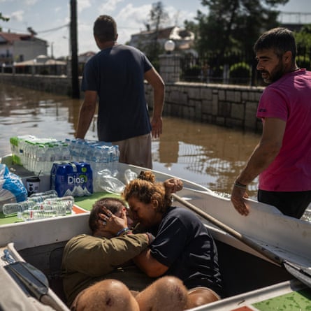 Volunteers rescue local people in the flooded village of Palamas near the city of Karditsa, central Greece, on 8 September 