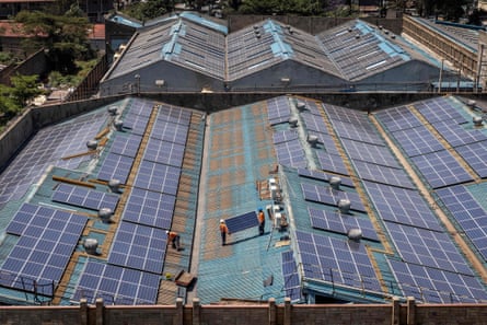 Technicians from CP Solar work on the maintenance of solar panels at a partially solar-powered factory in the industrial area of Nairobi, 9 October. Renewable energy sources generate over 80% of Kenya’s electricity but despite the tremendous potential of the country’s daily insolation, only 1% of the country’s energy mix has been tapped
