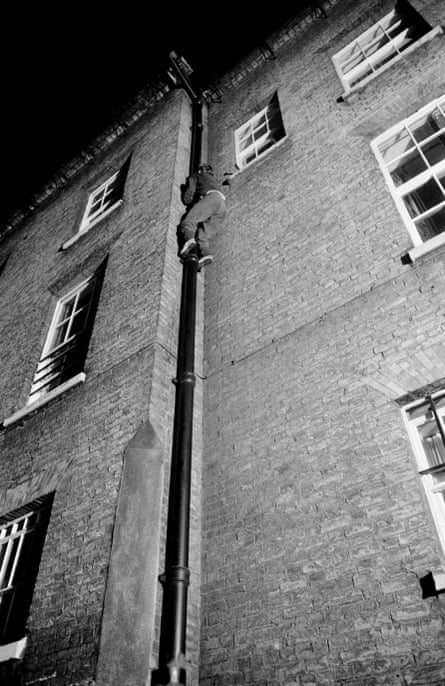 One of John Bulmer’s photographs of students night-climbing on the roof of one of Cambridge University’s historic buildings, circa June 1959.