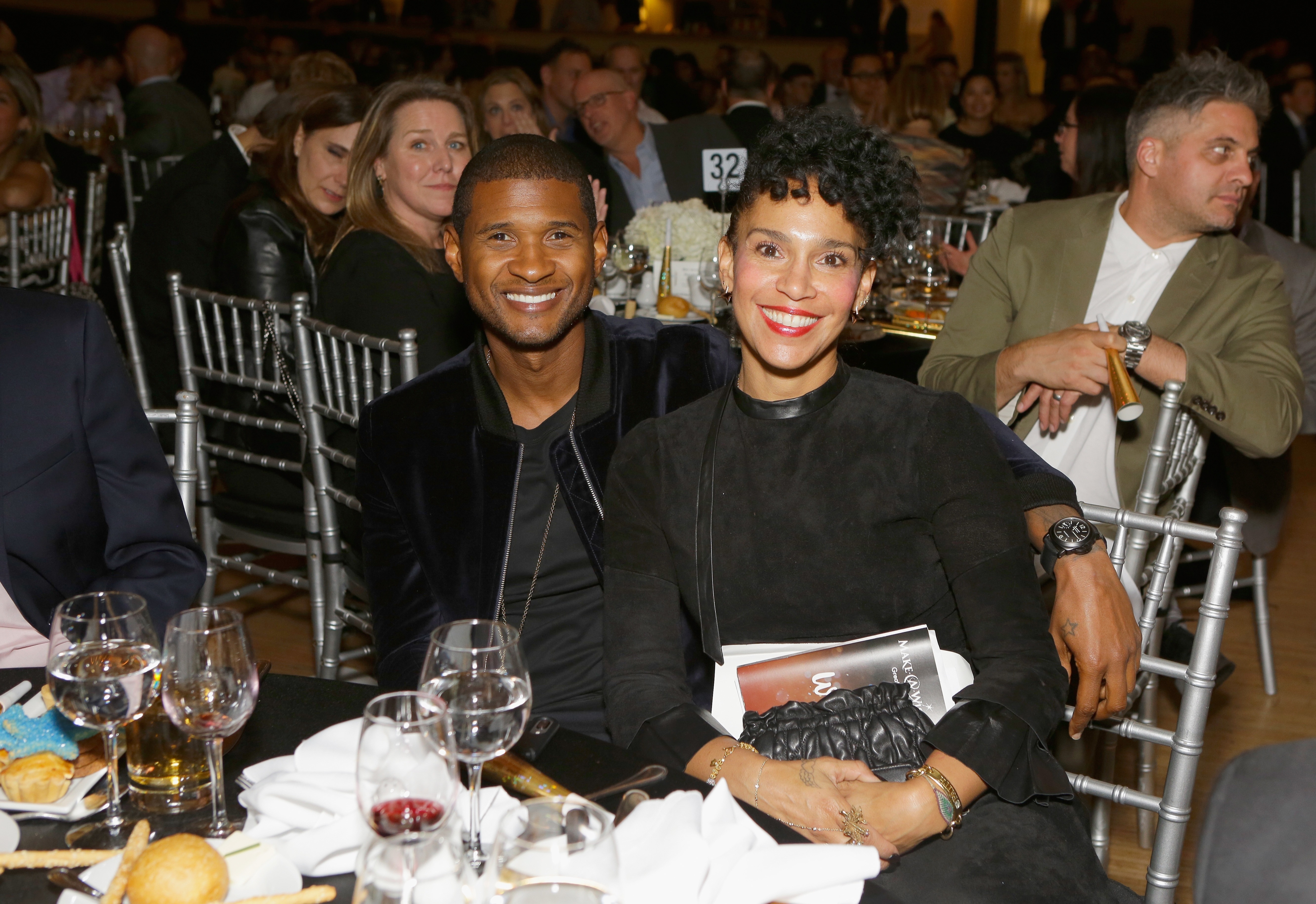 Usher with his second wife, Grace Miguel