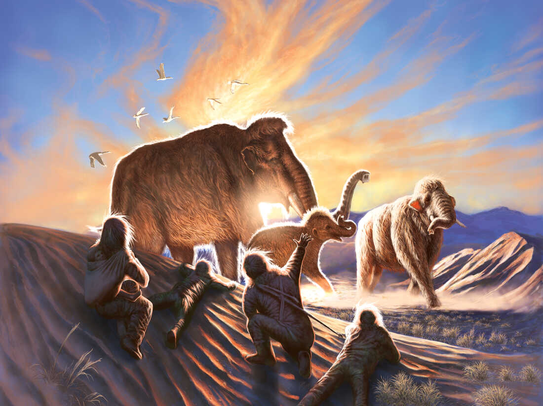 Illustration depicting woolly mammoths passing by ancient humans at the end of the last Ice Age thousands of years ago.