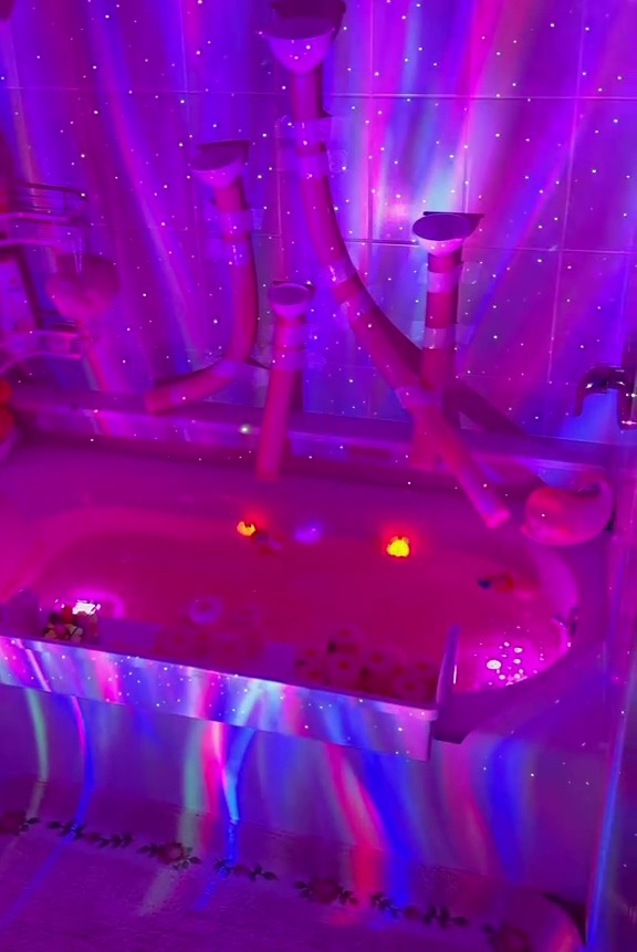 The DIY enthusiast finished it off using a light projector to make bath time a sensory experience