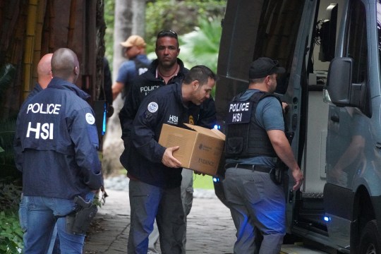 Sean Diddy Combs' home raid, men removing boxes 