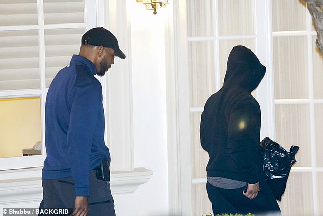 Justin Combs is seen for the first time returning and then leaving their family home during the cover of night