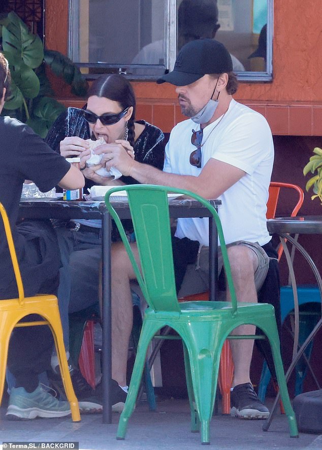 The duo sweetly shared a burrito, with Leo feeding his lady love as she took a bite