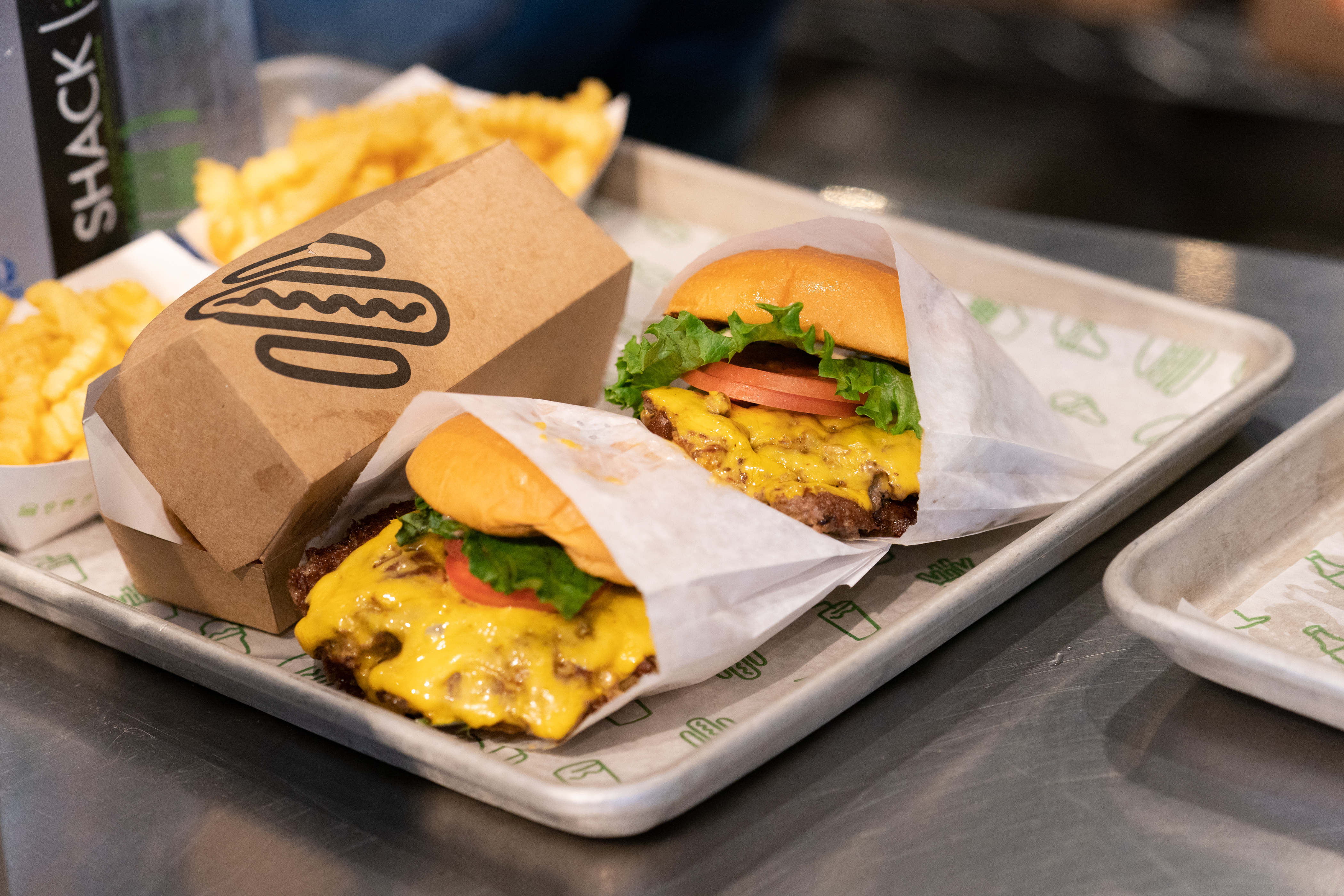 The popular food chain will be offering commuters burgers and curly fries