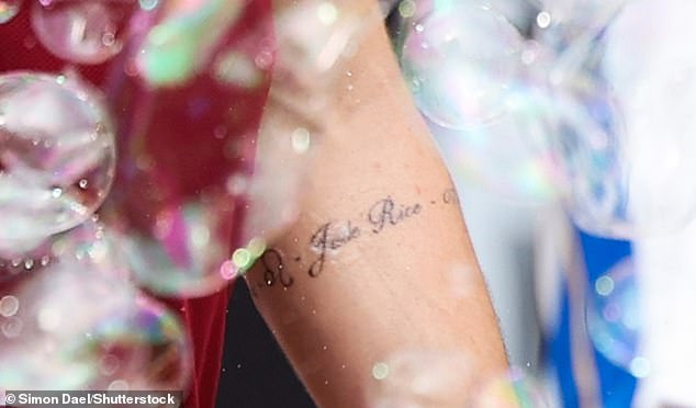 The tattoo, which circled the England international's lower left arm, revealed the name Jude, an apparent birthdate and a quote