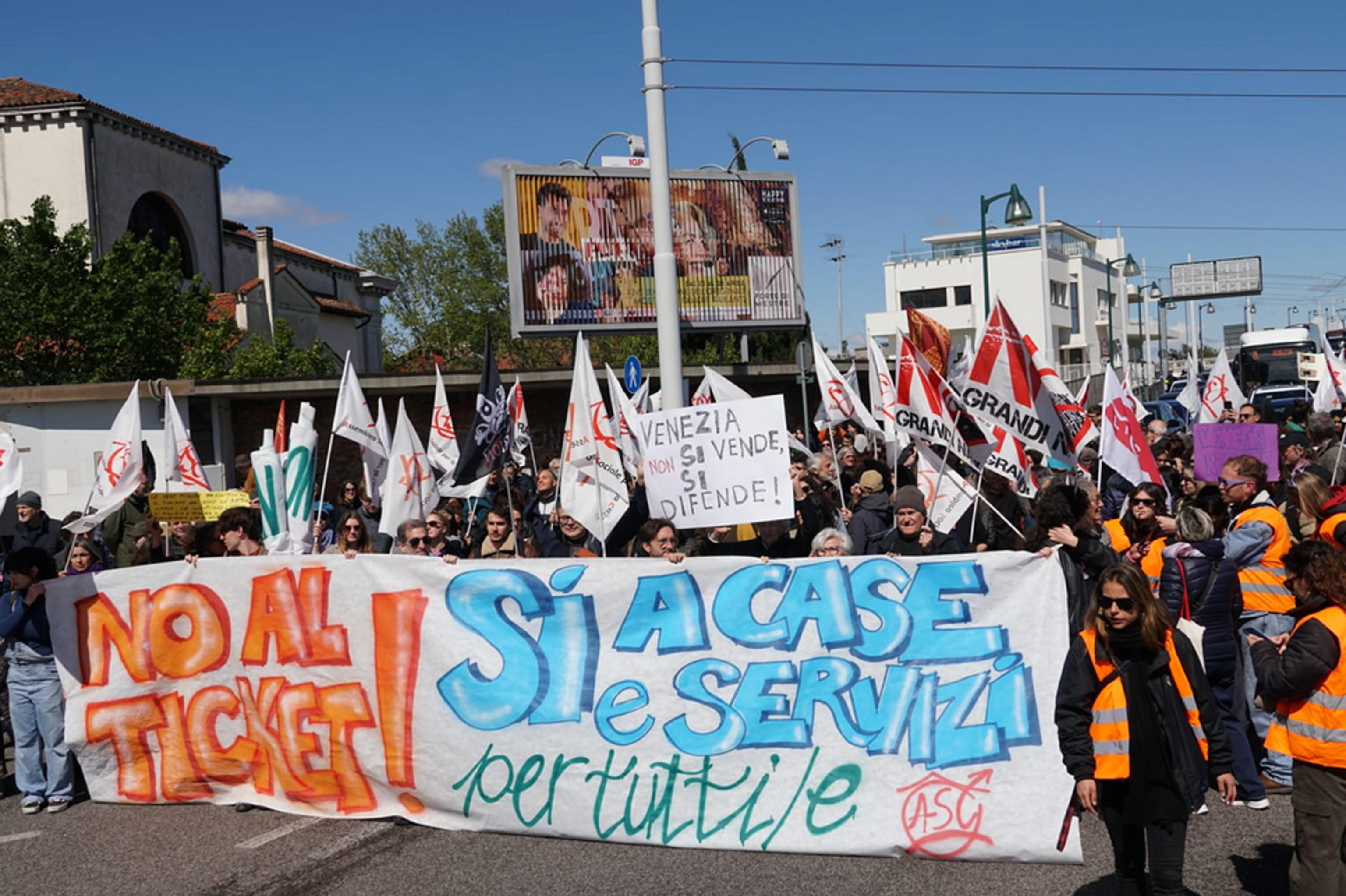 Members of social centers take part in a demonstration in Piazzale Roma against the introduction of the fee