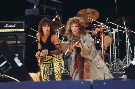 Richie Sambora and Jon Bon Jovi performing on stage with Bon Jovi