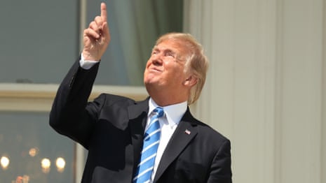 The moment Donald Trump is warned not to look directly at the sun – video