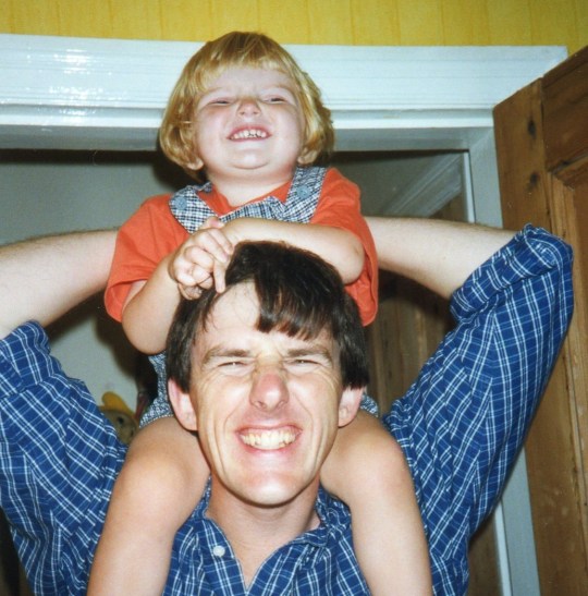 Ol photo of Jess as a baby on her dad's shoulders - both laughing