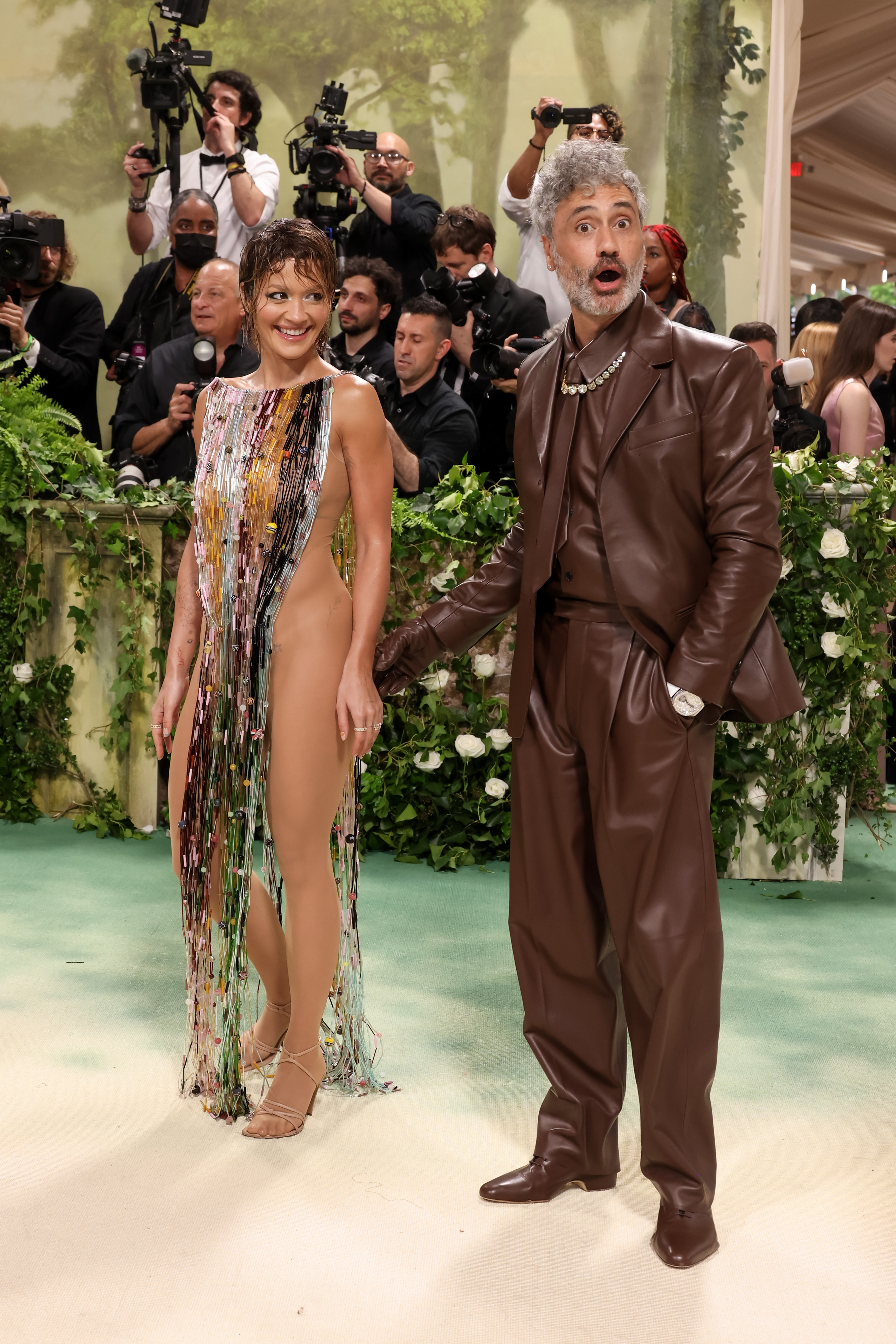 Rita donned a strappy, floor-length garment over a sheer bodysuit as she arrived at the Met Gala with her husband, Taika Waititi