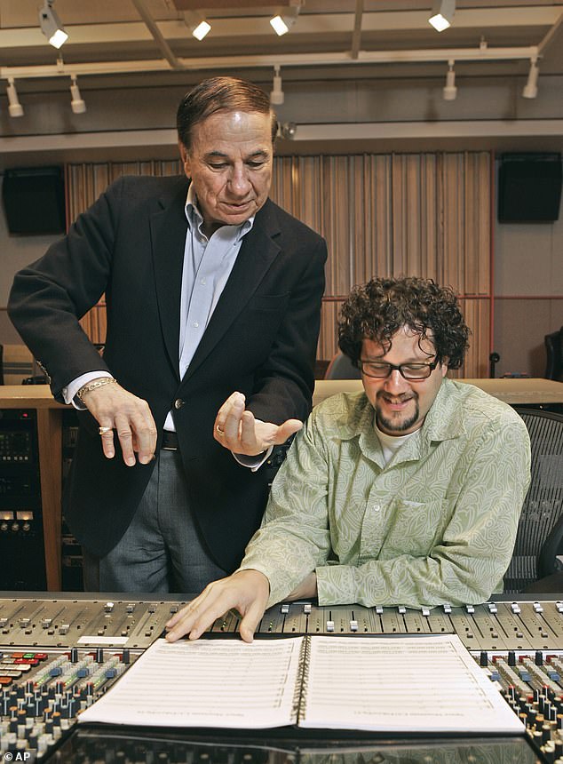 In 1958, the duo founded their own music publishing company called the Music World Corporation; seen with Michael Giacchino in a sound room in 2005