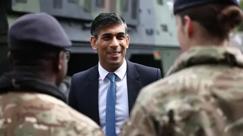 PA Media Prime Minister Rishi Sunak speaks with soldiers of various British troops as he visits the Julius Leber Barracks in Berlin to meet troops and see military equipment during his visit to Germany. Picture date: Wednesday April 24, 2024