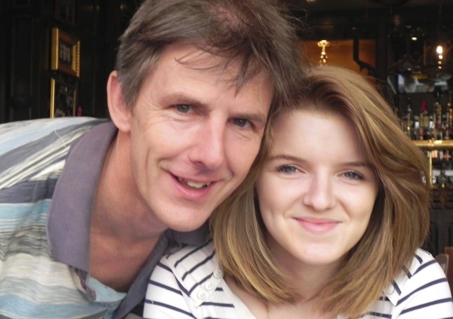 Jess with her dad - both in striped tops, at a pub