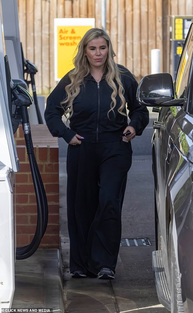 Georgia Kousoulou looked tense as she stepped out in Essex on Wednesday after her husband Tommy Mallet admitted he 'sold everything' amid financial woes