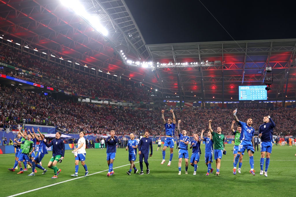 Italy celebrate after clinching their place in the knockout rounds