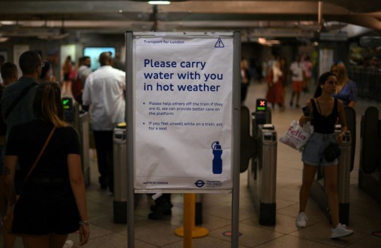 A please carry water sign on the Tube