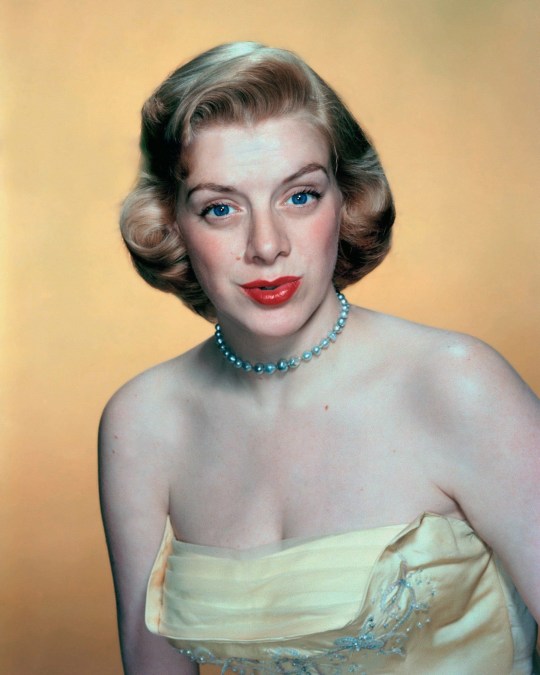 Singer and actress Rosemary Clooney in the 1950s wearing a cream dress and pearl necklace