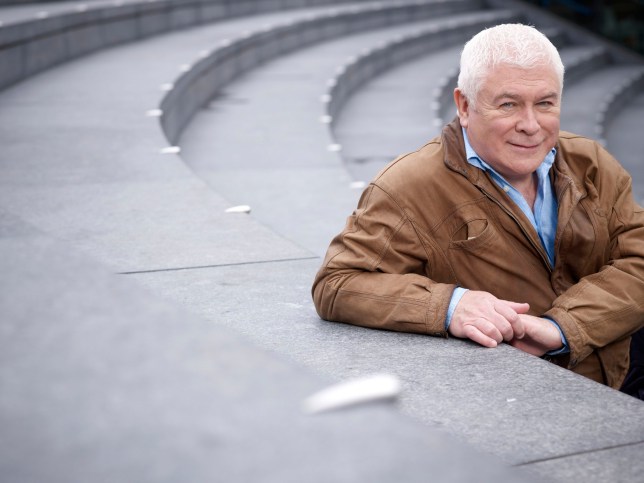 Sean Rafferty sitting on steps