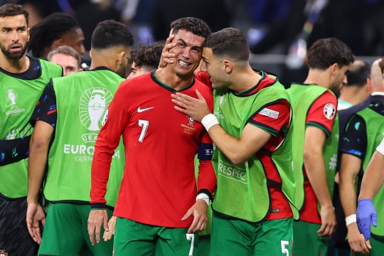 Cristiano Ronaldo of Portugal visibly upset after missing a penalty is spoken to by Diogo Dalot of Portugal during the UEFA EURO 2024 round of 16 match between Portugal and Slovenia at Frankfurt Arena