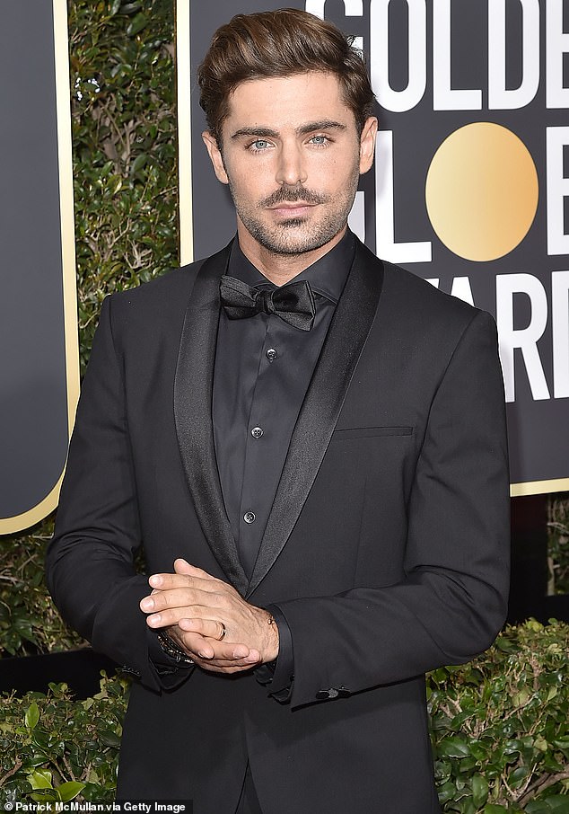 Zac Efron pictured at the Golden Globe Awards in January 2018 - three years before his fall