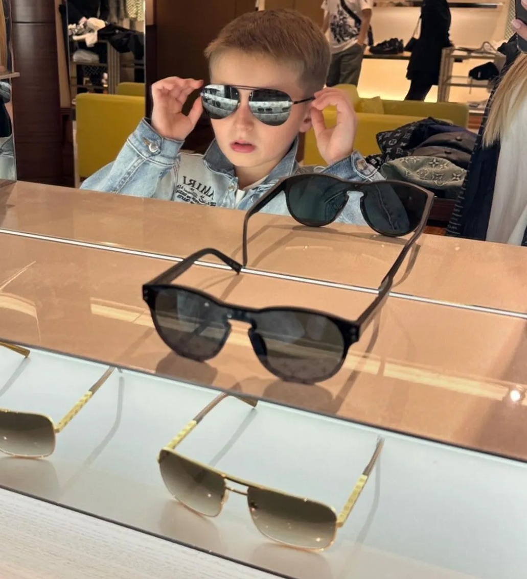 The Aussie family like to treat themselves to posh designer gear, including high-end sunnies for their son