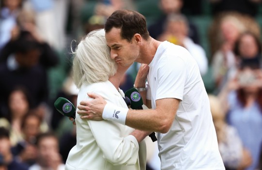 LONDON, ENGLAND - JULY 04: Sue Barker embraces with Andy Murray of Great Britain following his defeat in the Gentlemen???s Doubles first round match with Jamie Murray against Rinky Hijikata and John Peers of Australia during day four of The Championships Wimbledon 2024 at All England Lawn Tennis and Croquet Club on July 04, 2024 in London, England. (Photo by Francois Nel/Getty Images)
