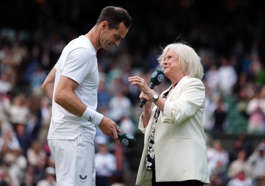 Andy Murray with Sue Barker following his gentlemen's doubles match with Jamie Murray at Wimbledon