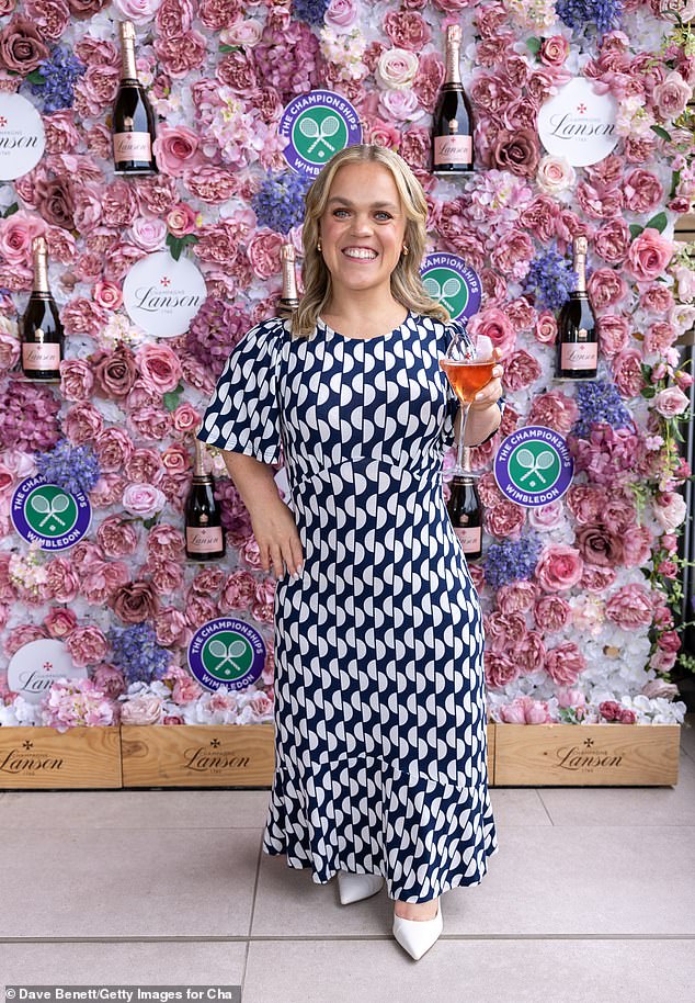 Ellie, 29, opted for a blue and white geometric patterned midi dress and white heels as she grinned in snaps