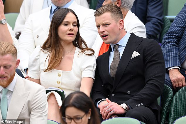 Holly and Adam were seen chatting in the crowd as the match began