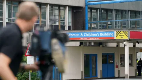 Reuters Cameraman filming outside the hospital