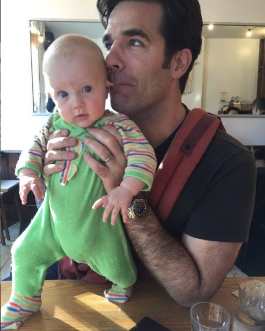 Rob Delaney holds his young son Henry